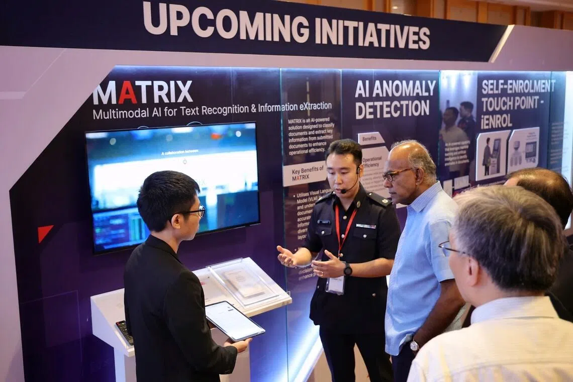 Coordinating Minister for National Security and Home Affairs Minister K. Shanmugam listening to an introduction on the Multimodal AI for Text Recognition and Information eXtraction (MATRIX) at the exhibition of ICA’s Work Plan Seminar 2026 on May 8.