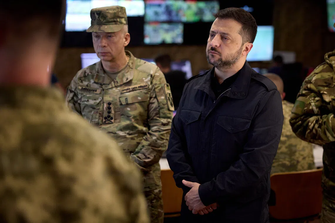 General Oleksandr Syrskyi (left) and Ukrainian President Volodymyr Zelensky during a visit by Ukraine's leader to the fonrt lines in Ukraine's Donetsk region.