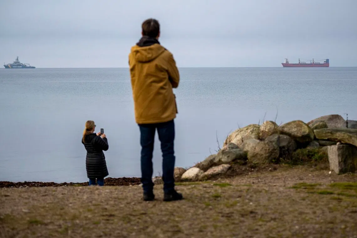 The owners of the Russian freighter, the Adler (right), are on the European Union’s sanctions list.