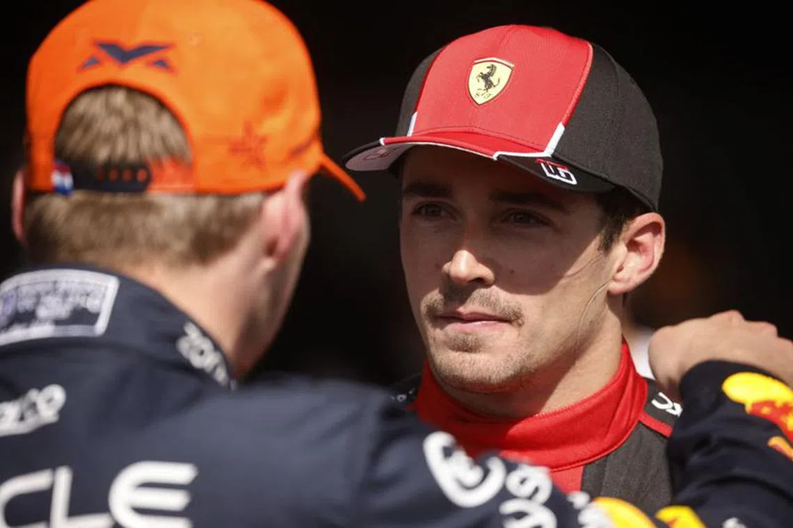 Formula One F1 - Belgian Grand Prix - Spa-Francorchamps, Spa, Belgium - July 30, 2023 Ferrari's Charles Leclerc is pictured with the race winner Red Bull's Max Verstappen after finishing in third place REUTERS/Johanna Geron