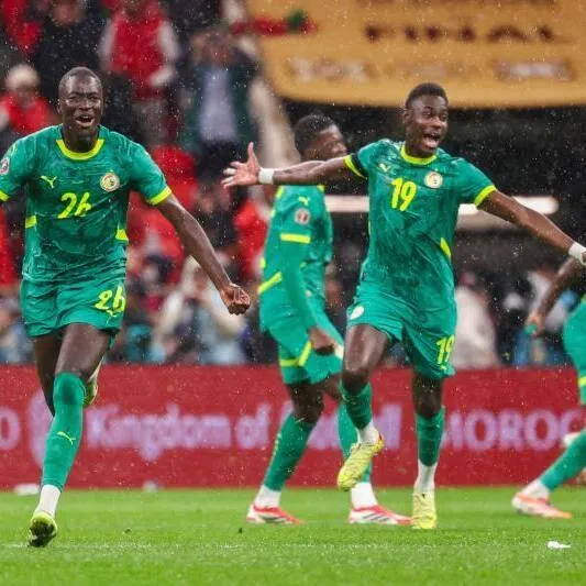  Senegal's midfielder Pape Gueye (left) and his teammates celebrates their victory at the end of the Africa Cup of Nations final football match between Senegal and Morocco.