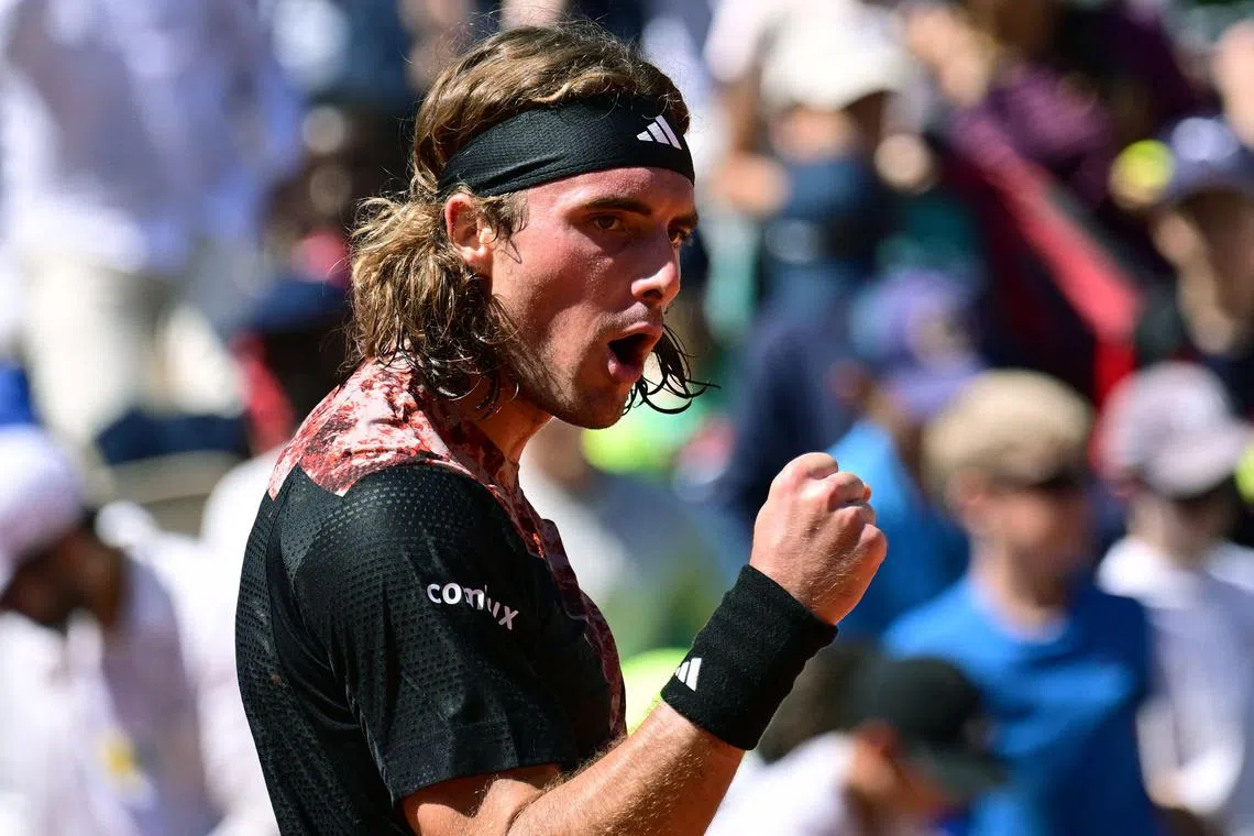 Stefanos Tsitsipas celebrating an incident-free path into the third round of the French Open with a win over Roberto Carballes Baena on Wednesday .