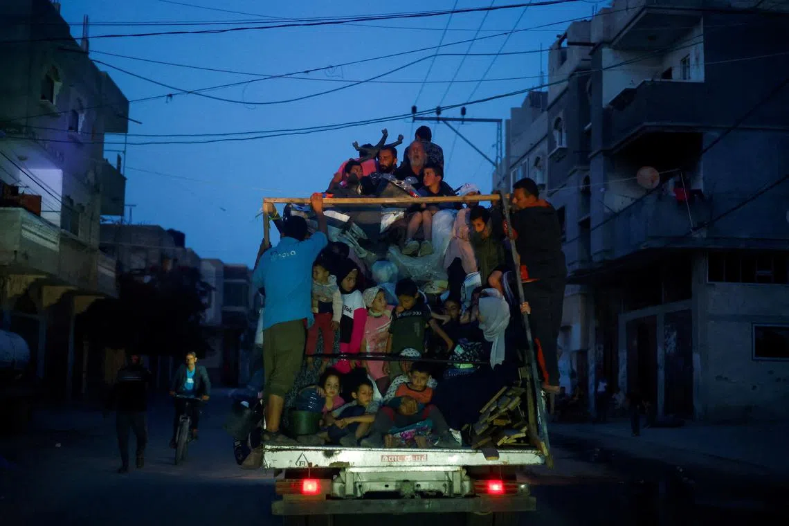 Palestinians ride on a vehicle as they flee Rafah after Israeli forces launched a ground and air operation in the eastern part of the southern Gaza City, amid the ongoing conflict between Israel and Hamas, in Rafah, in the southern Gaza Strip May 9, 2024. REUTERS/Mohammed Salem     TPX IMAGES OF THE DAY