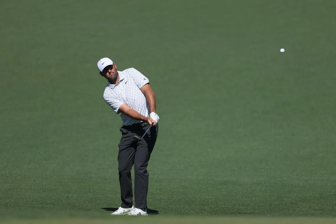 Scottie Scheffler of the United States chips onto the second green during the second round of the Masters.