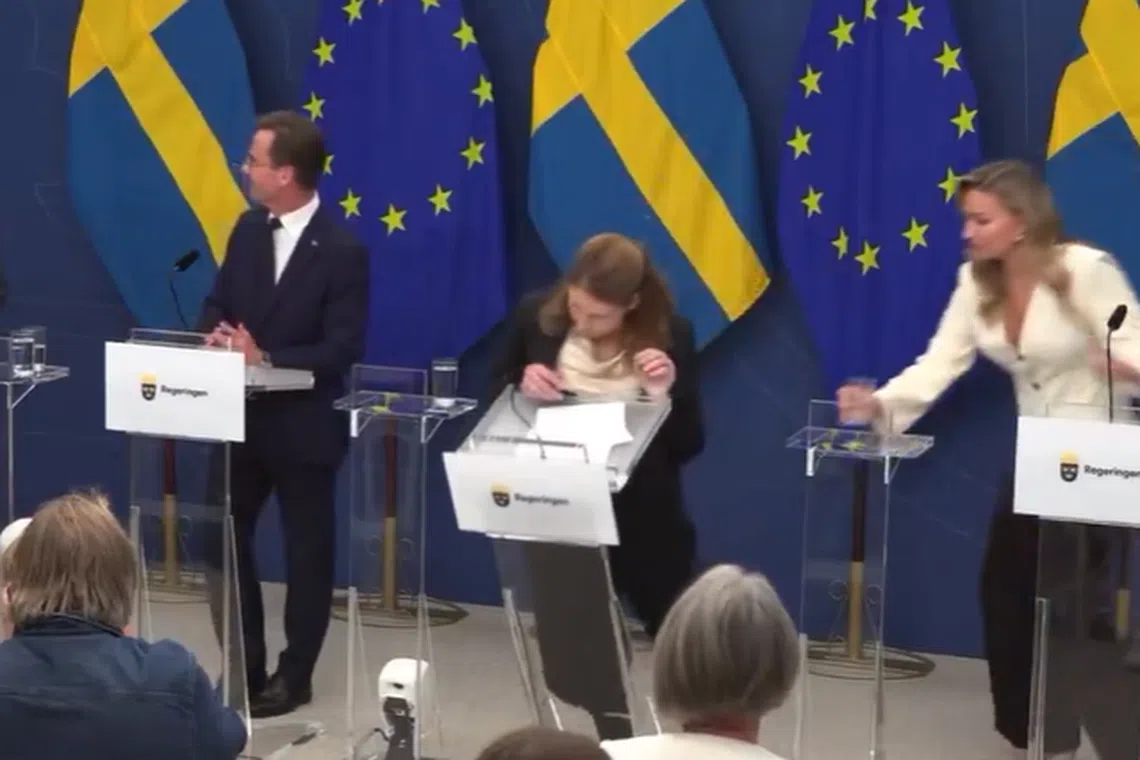 Videos, which has gone viral on social media, showed Ms Lann tumbled forward to the ground, taking a transparent lectern with her.