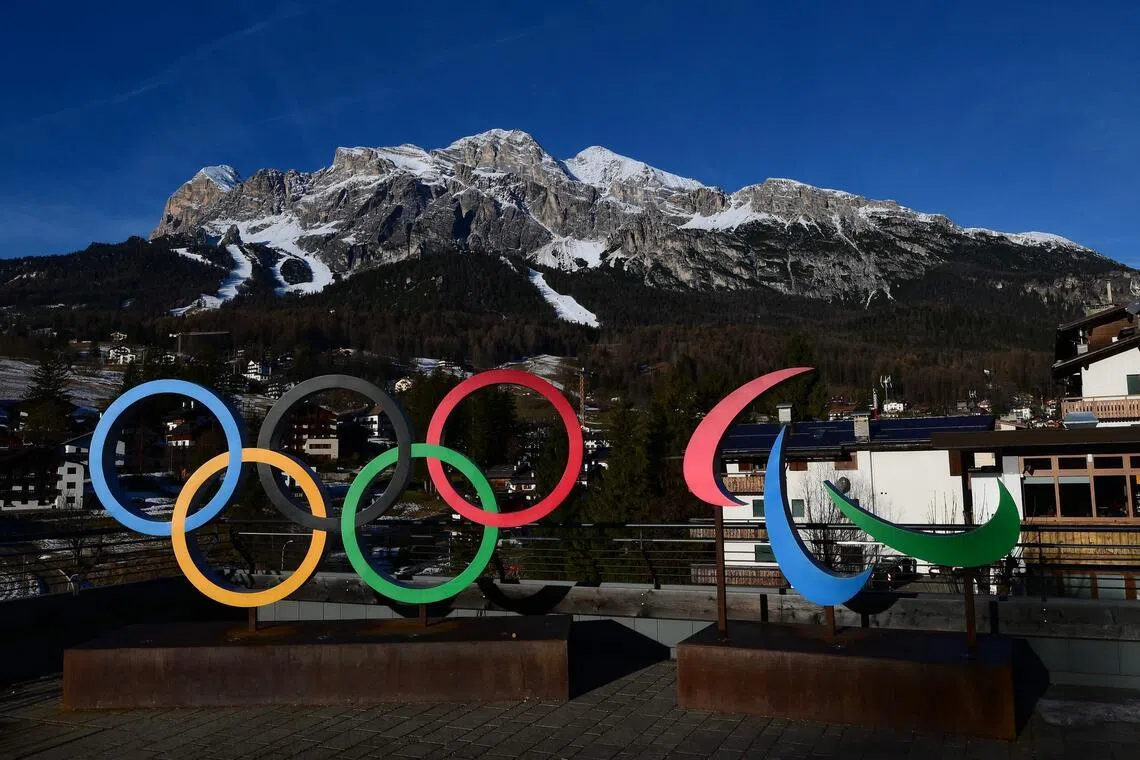 A picture shows the logo of Milano Cortina 2026 Olympic and Paralympic Games with the Women's Alpine skiing Olympia delle Tofane slope in the background, in Cortina d'Ampezzo, on Dec 12, 2025. 