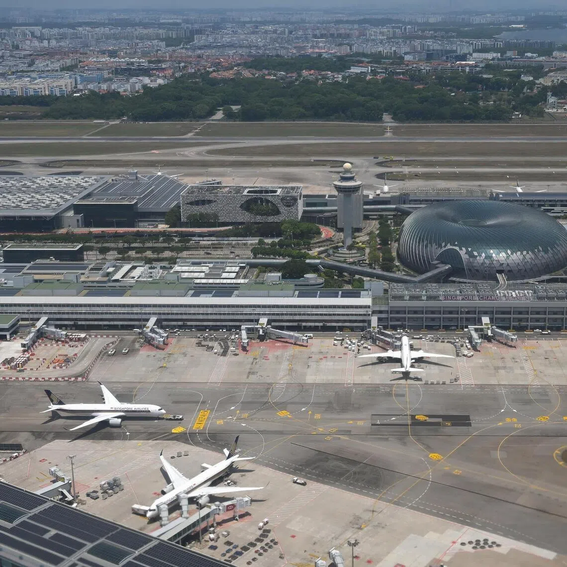 Jewel Changi Airport and the airport control tower seen from a plane on Mar 24, 2026.