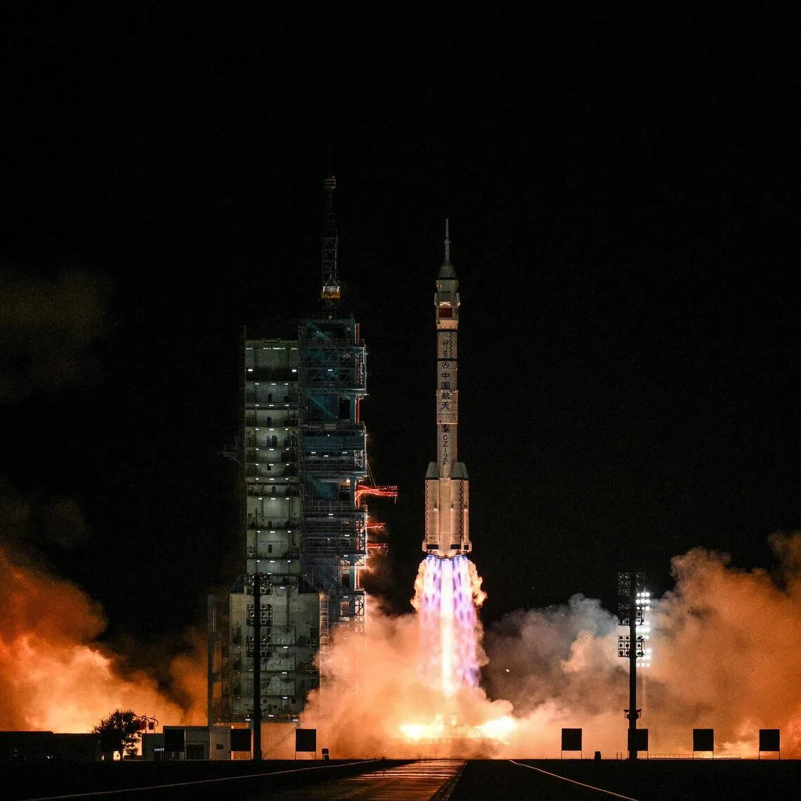 The Shenzhou-21 spacecraft, with a crew of  three astronauts, lifting off in the Gobi desert, in north-west China, in October 2025.