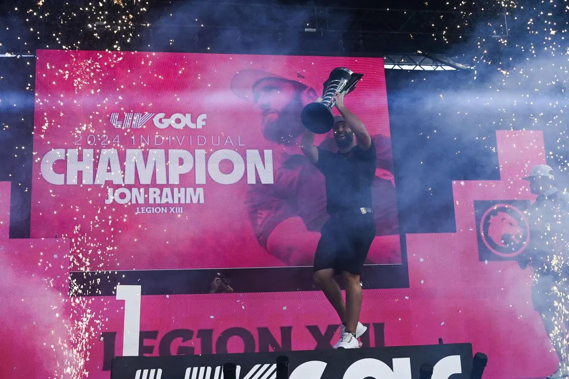 Jon Rahm of the Legion XIII holding the individual trophy after winning the LIV Golf Chicago tournament at Bolingbrook Golf Club. 