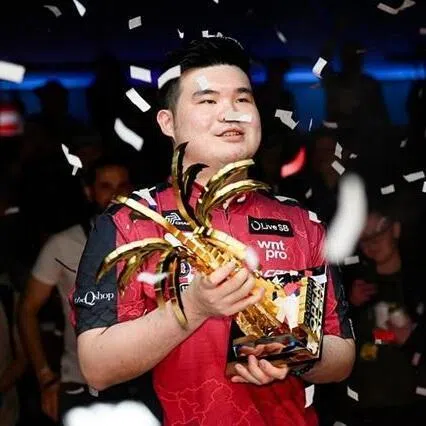 Singapore pool pro Aloysius Yapp lifts the Florida Open trophy for one of his 10 titles in 2025.