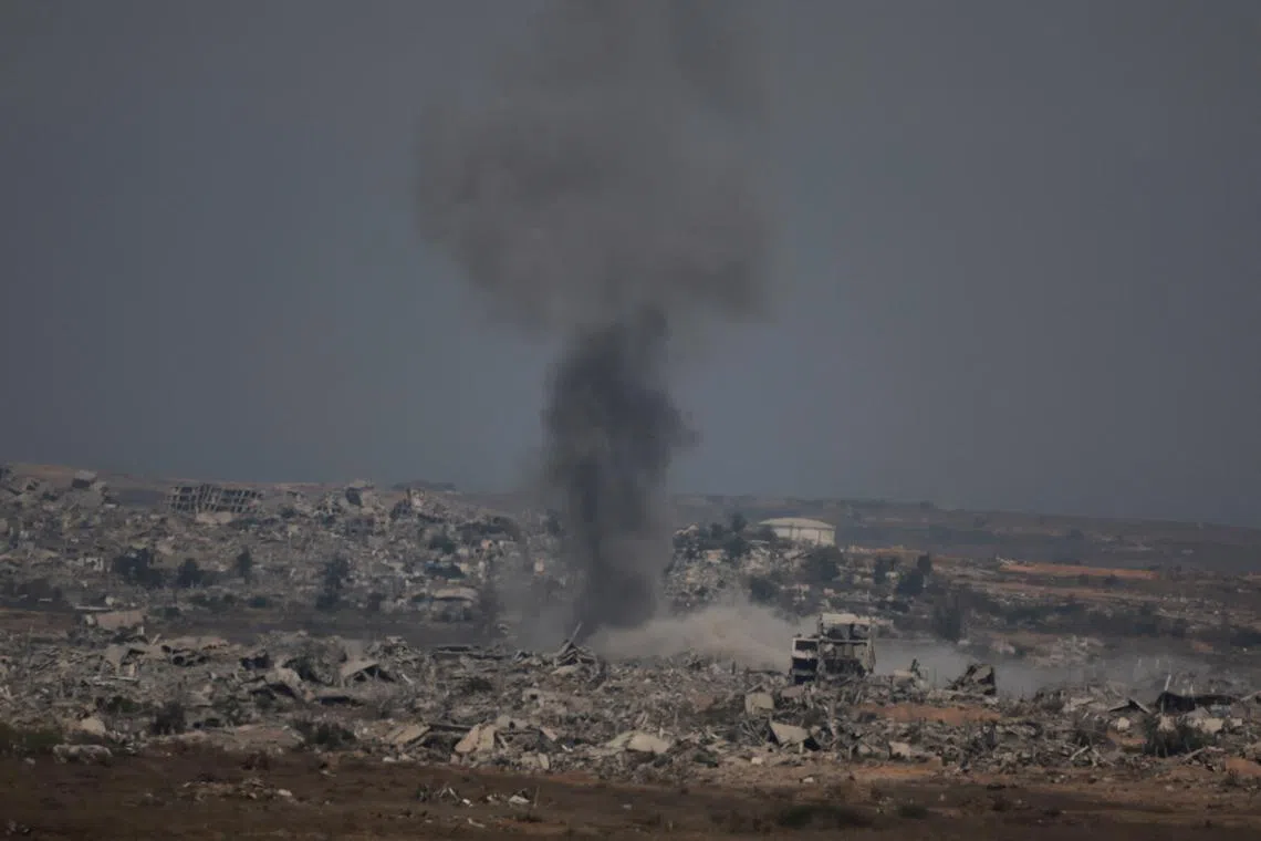 Smoke rises after an Israeli air strike in north Gaza, as seen from Israel's border with Gaza, Israel August 12, 2025. REUTERS/Ammar Awad