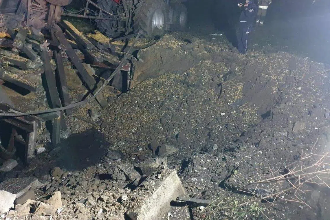 A view shows damages after an explosion in Przewodow, a village in eastern Poland near the border with Ukraine, in this image obtained from social media by Reuters released on November 15, 2022. /via REUTERS THIS IMAGE HAS BEEN SUPPLIED BY A THIRD PARTY. MANDATORY CREDIT. NO RESALES. NO ARCHIVES.
Reuters has verified the photographs in the following ways: The images do not exist on the internet already so are unlikely to be old, they show first responders wearing Polish paramedic and firefighter uniforms, there is a destroyed tractor and trailer with grain on the ground and Polish media reported the explosion occurred at a grain facility in Przewodow. Satellite imagery shows what appears to be an agricultural facility in Przewodow with large storage barns. However the photographs do not show enough of the surrounding area to provide a positive geolocation match with satellite imagery.