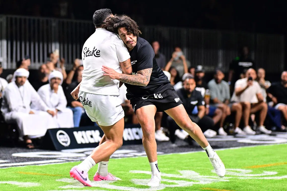 Jordan Simi (left) competes against Kevin Proctor during the RUNIT Championship League in Dubai on June 28, 2025.