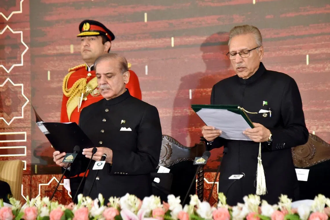 Pakistan's President Arif Alvi administers the oath to Pakistan's newly elected Prime Minister Shehbaz Sharif, at the Presidential Palace in Islamabad, Pakistan March 4, 2024. Presidential Palace/Handout via REUTERS