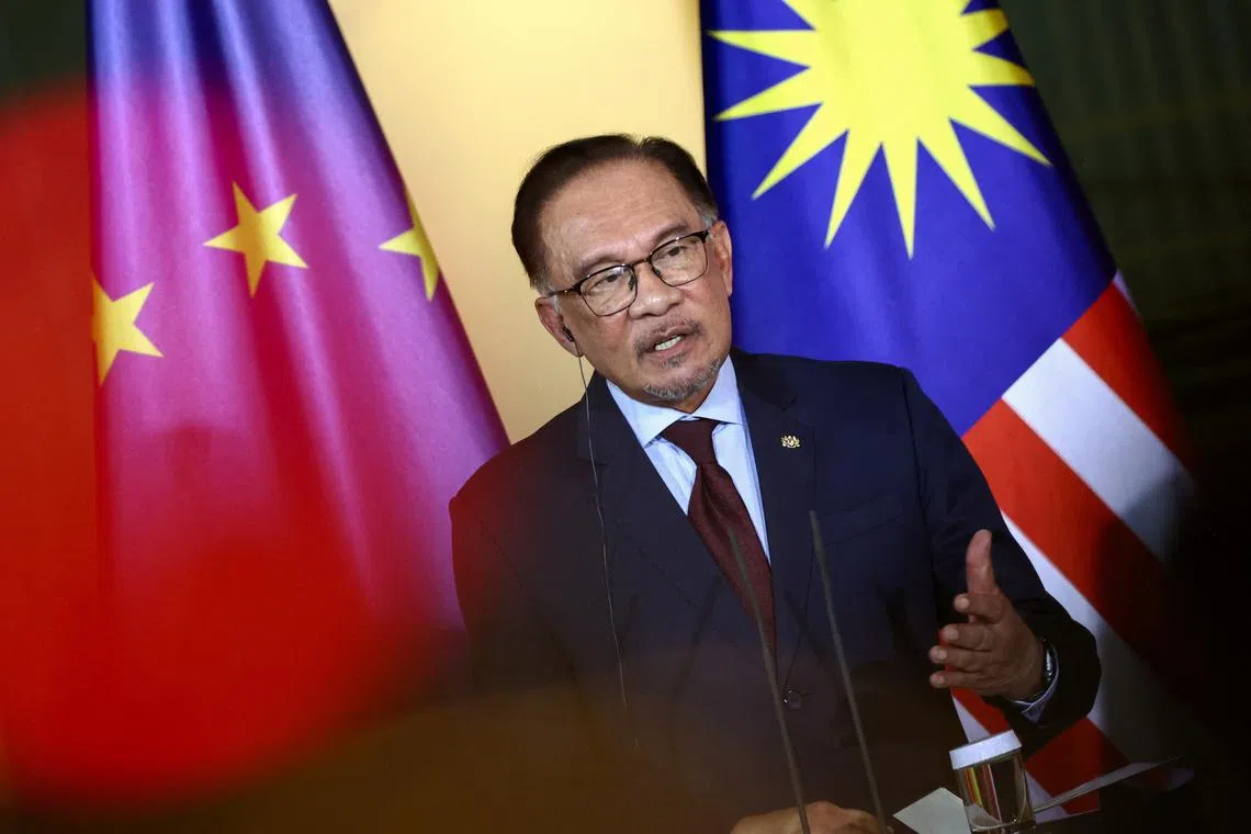 Malaysia's Prime Minister Anwar Ibrahim holds a press conference with German Chancellor Olaf Scholz (not pictured) in Berlin, Germany, March 11, 2024. REUTERS/Liesa Johannssen/File Photo