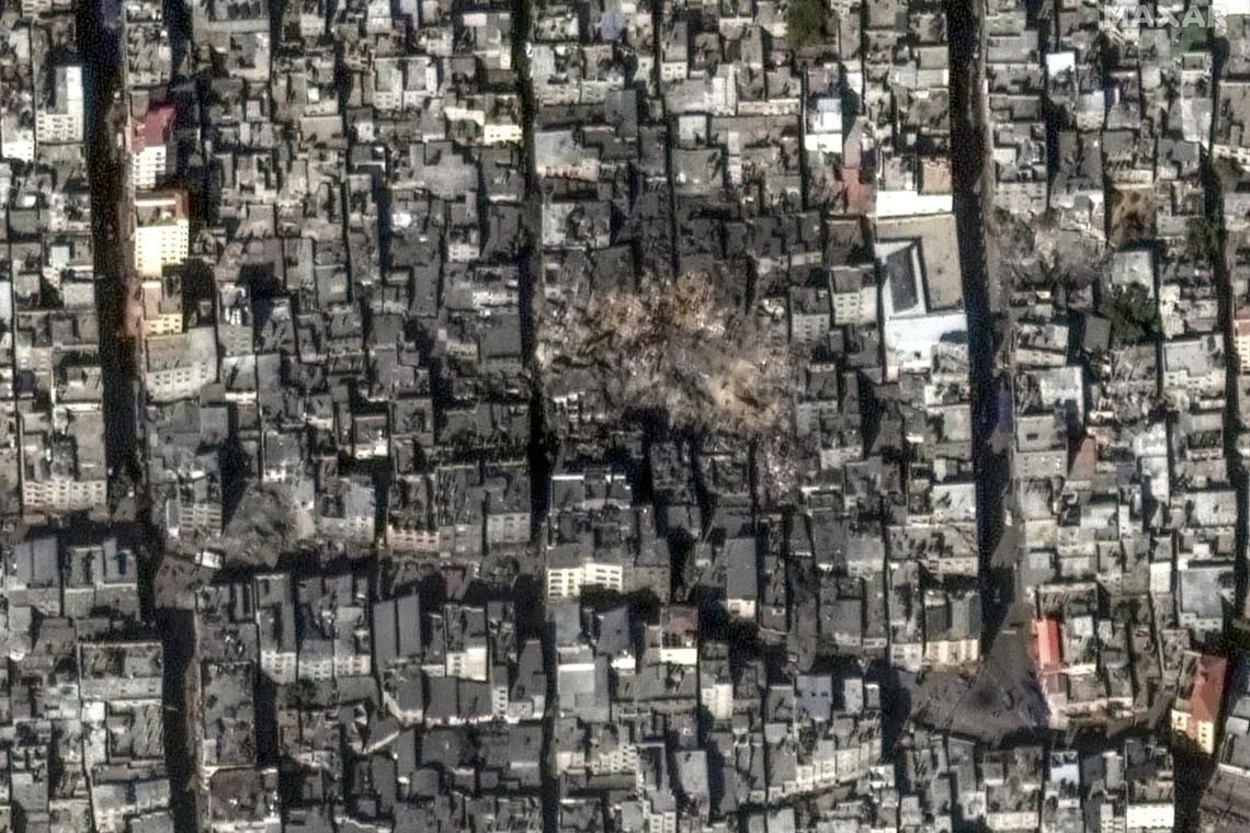 In a satellite image provided by Maxar Technologies, the site in the Jabaliya neighbourhood of Gaza on Wednesday, after it was decimated by Israeli airstrikes. 