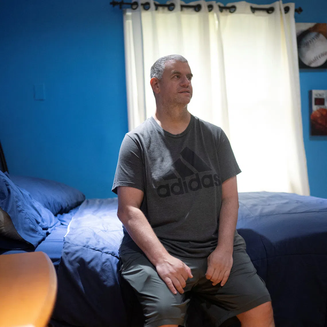 Richie Rosen, a resident of a facility that houses people with developmental disabilities, where three Haitian caregivers who held Temporary Protected Status (TPS) worked until the Supreme Court decision ended TPS for Haitians, poses for a portrait in New City, New York, U.S., August 11, 2026.  REUTERS/Vincent Alban