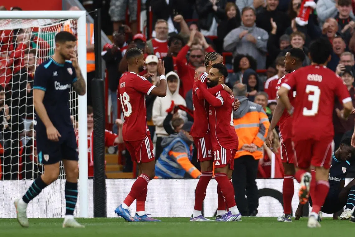 FILE PHOTO: Soccer Football - Friendly - Liverpool v Athletic Bilbao - Anfield, Liverpool, Britain - August 4, 2025 Liverpool's Mohamed Salah celebrates scoring their first goal with Hugo Ekitike and Cody Gakpo Action Images via Reuters/Lee Smith/File Photo