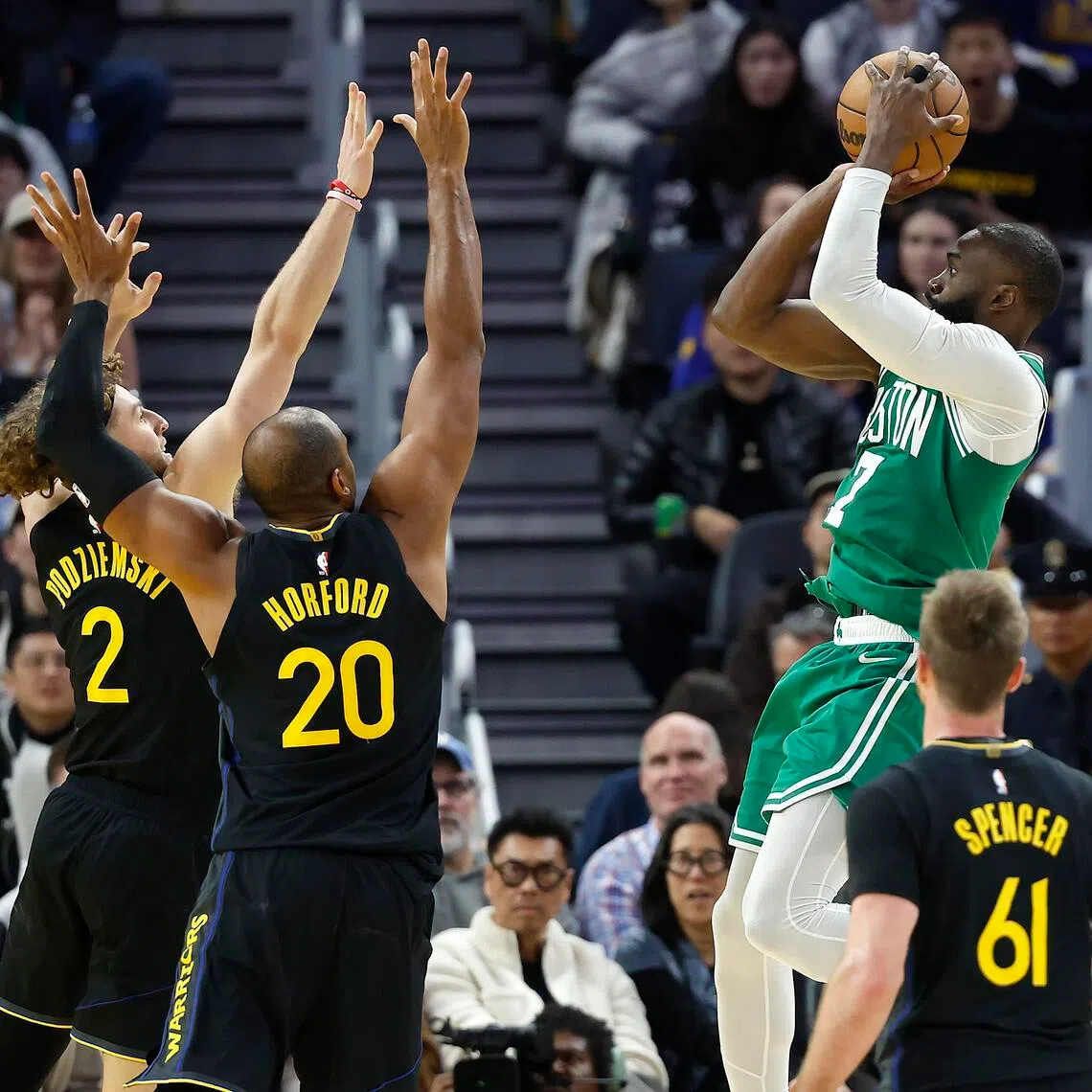 The Boston Celtics' Jaylen Brown shooting as Brandin Podziemski and Al Horford defend during the Golden State Warriors' 121-110 NBA defeat at the Chase Center on Feb 19, 2026.