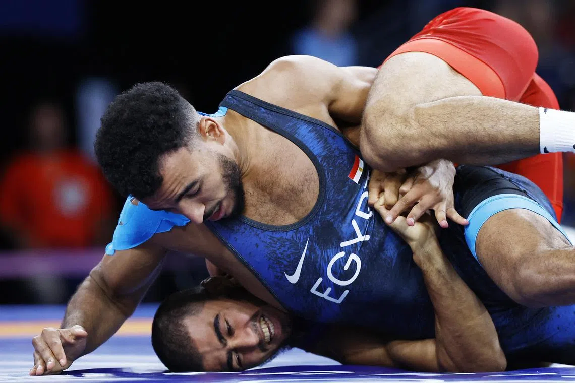 Egypt's Mohamed Elsayed competing against Azerbaijan's Hasrat Jafarov in the 67kg Greco-Roman wrestling.