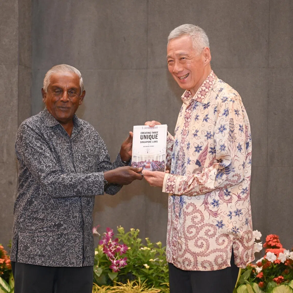 S Jayakumar presenting SM Lee Hsien Loong with the book – Creating Three Unique Singapore Laws: An Inside Story – at the Ministry of Foreign Affairs on Aug 12.