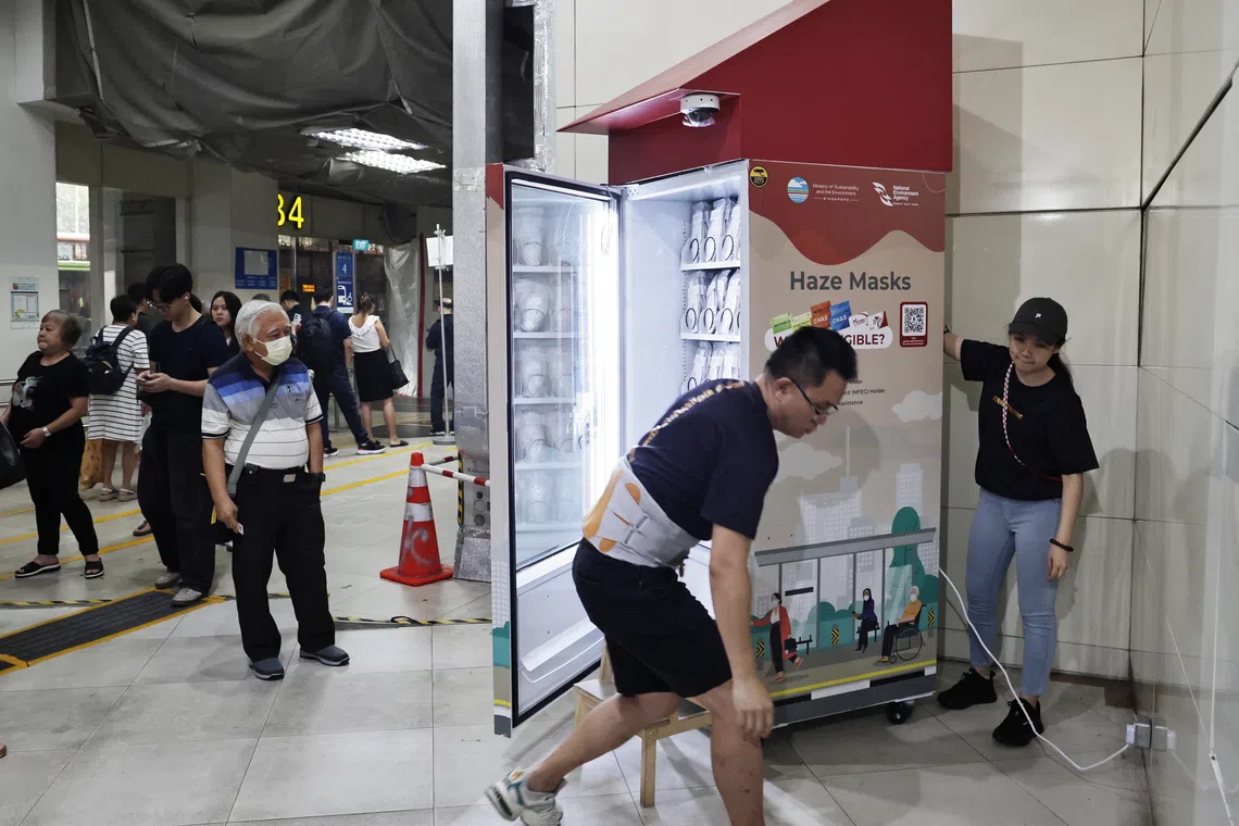 Allan Chan, 78, waiting for a mask vending machine to be set up at Clementi Bus Interchange on Oct 14.