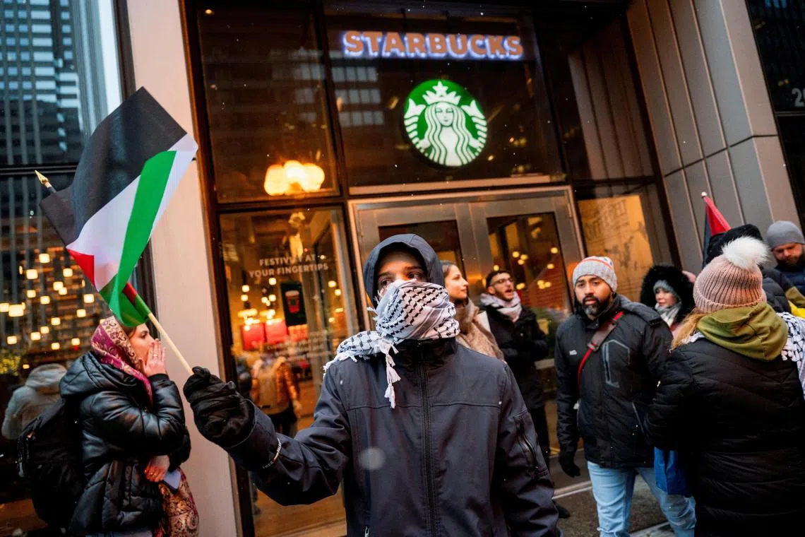Activists of the group "Chicago Youth Liberation for Palestine" protest in support of Palestinians at a Starbucks in Chicago, amid protests nationwide and calls for a ceasefire between Israel and Hamas.