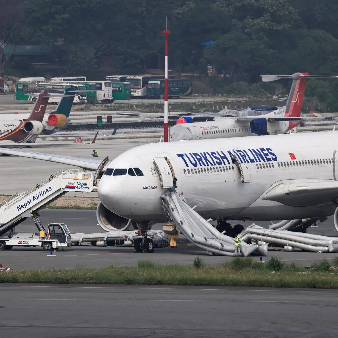 An airbus belonging to Turkish Airlines is parked at Tribhuvan International Airport after a minor fire broke out while landing in Kathmandu, Nepal, on May 11.