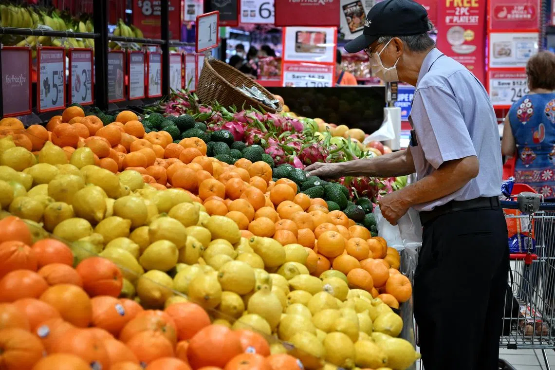ST20240117_202408058035 Kua Chee Siong/ pixgeneric/ Generic pix of an elderly man shopping for fruits at the FairPrice Xtra AMK Hub in Ang Mo Kio Avenue 3 on Jan 17, 2024.
Can be used for stories about rush, CNY, Chinese New Year shopping, groceries.