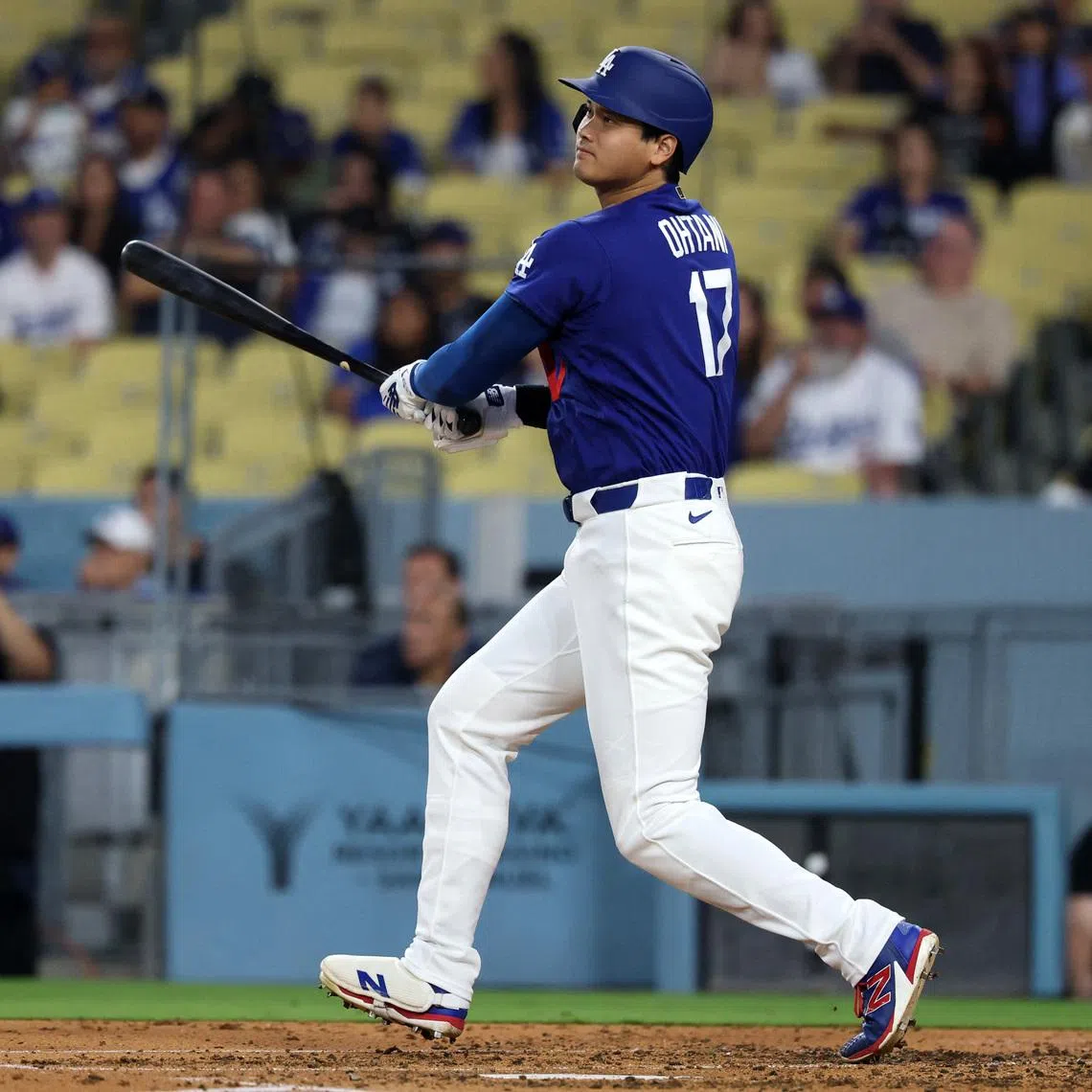 Mar 23, 2026; Los Angeles, California, USA;  Los Angeles Dodgers designated hitter Shohei Ohtani (17) hits a double during the third inning against the Los Angeles Angels at Dodger Stadium. Mandatory Credit: Kiyoshi Mio-Imagn Images