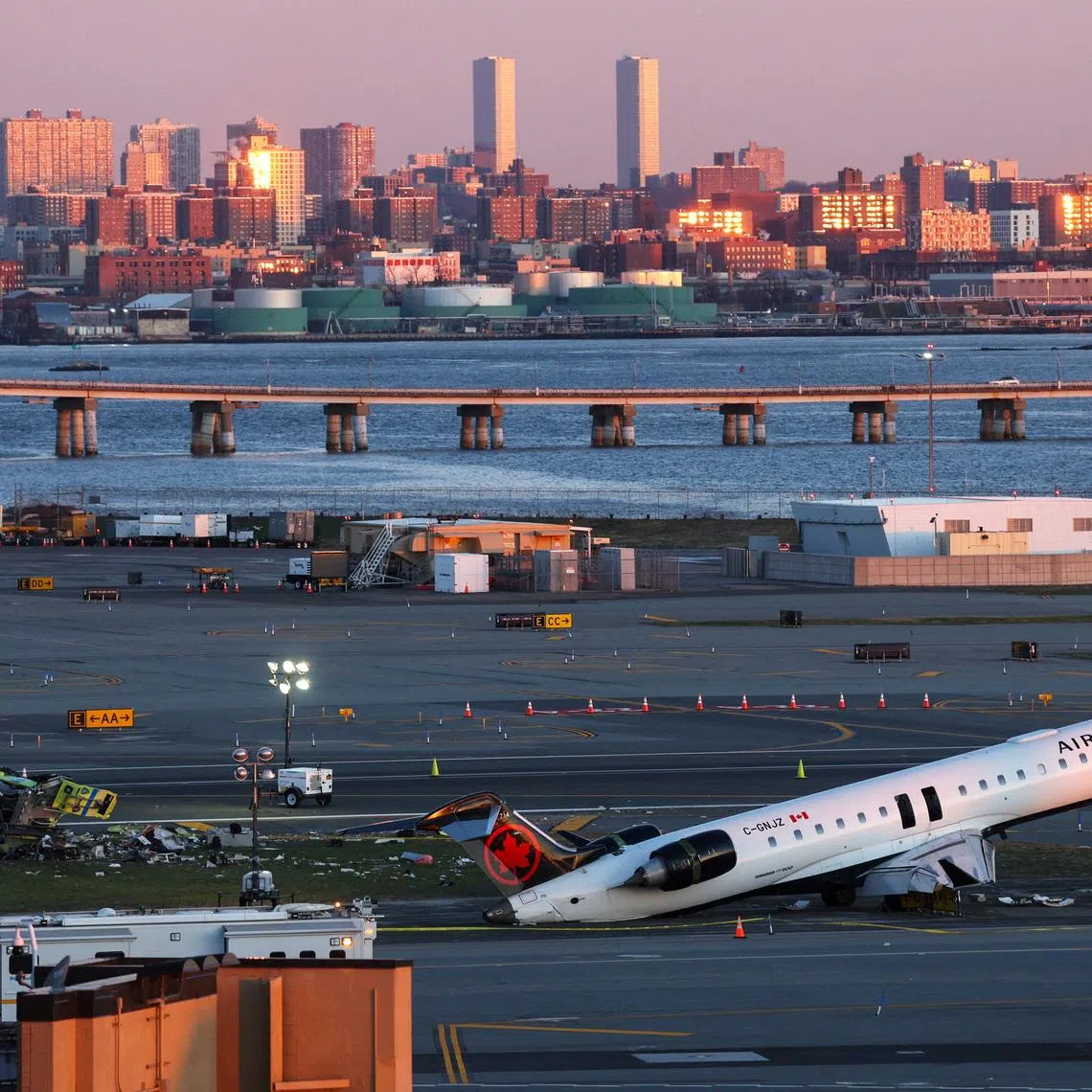 FILE PHOTO: The wreckage of an Air Canada Express jet that collided with a ground vehicle on Monday at New York's LaGuardia Airport in Queens, New York, U.S., March 24, 2026. REUTERS/Shannon Stapleton/File Photo