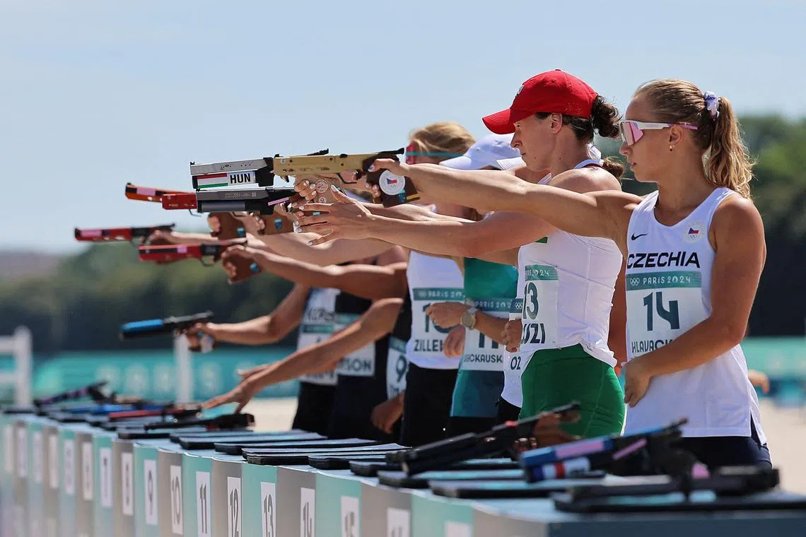 Lucie Hlavackova of Czech Republic and other modern pentathlon competitors in the women's final laser run at the Paris Olympics at Chateau de Versailles on Aug 11, 2024.
