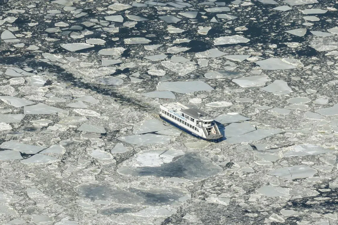An aerial view of the Hudson River as a water taxi makes it way through the icy river during freezing temperatures, seen from the Edge observation deck in New York City, U.S on Jan 28, 2026. 