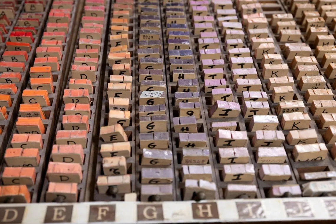 A set of colour samples for mosaic tiles is arranged in labelled compartments inside the Vatican Mosaic Studio at the Vatican, on Feb 19.
