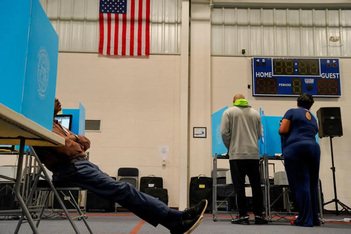 Local residents cast their ballots during the midterm elections at Canaan Baptist Church in Columbus, Georgia, US, on Nov 8, 2022.