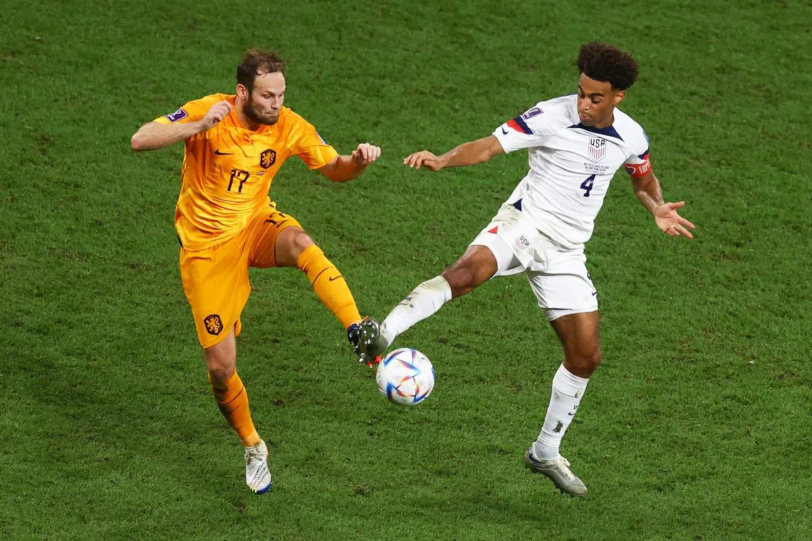 Netherlands' Daley Blind in action with Tyler Adams of the US.
