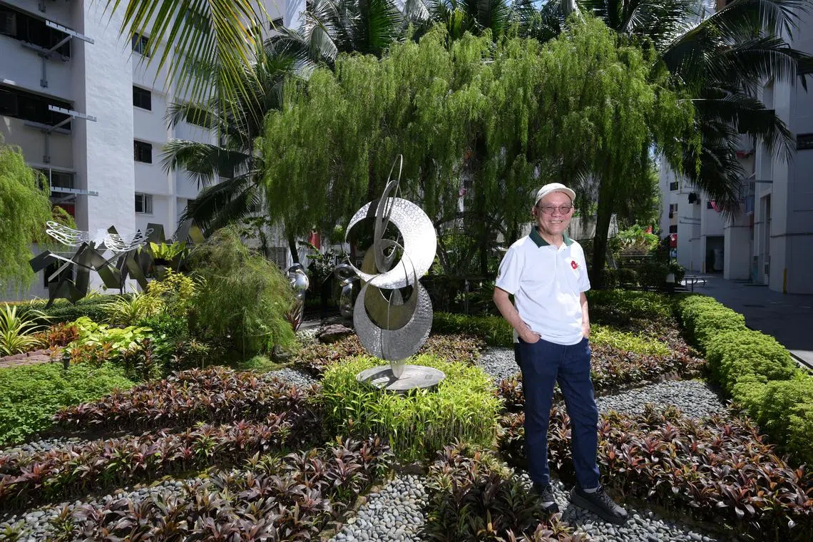 vlbloom/ST20250825_202501600222/Ng Sor Luan/Community garden spaces at the Bukit Batok Residents' Network, including its sculptures and sustainable features like aquaponics. Artist Richard Ashworth with his sculpture Unity.