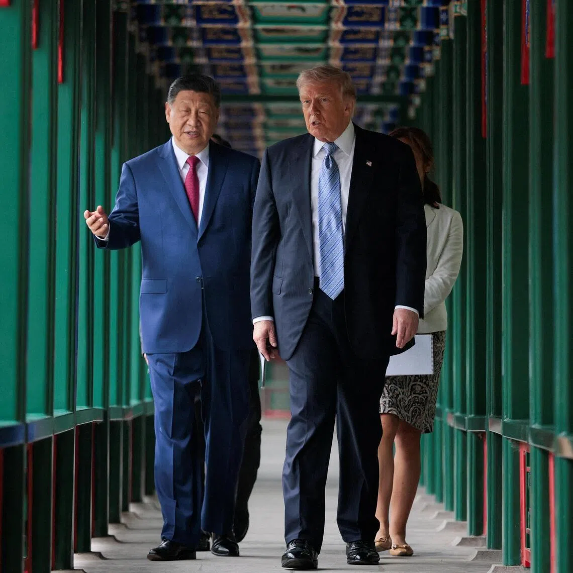 US President Donald Trump participates in a friendship walk through Zhongnanhai Garden with Chinese President Xi Jinping in Beijing, China, May 15, 2026.