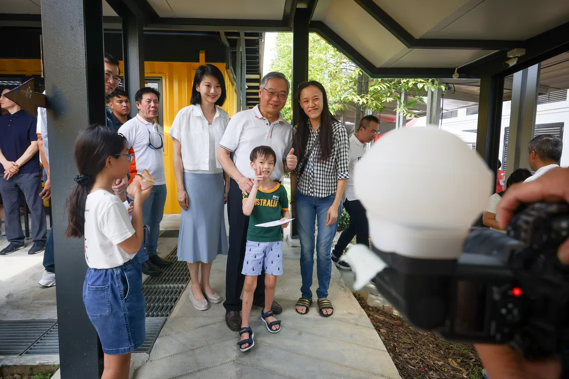 DPM Gan Kim Yong and Senior Minister of State for National Development Sun Xueling (left) with Suncare SG beneficiaries during a Children's Day event on Oct 4.