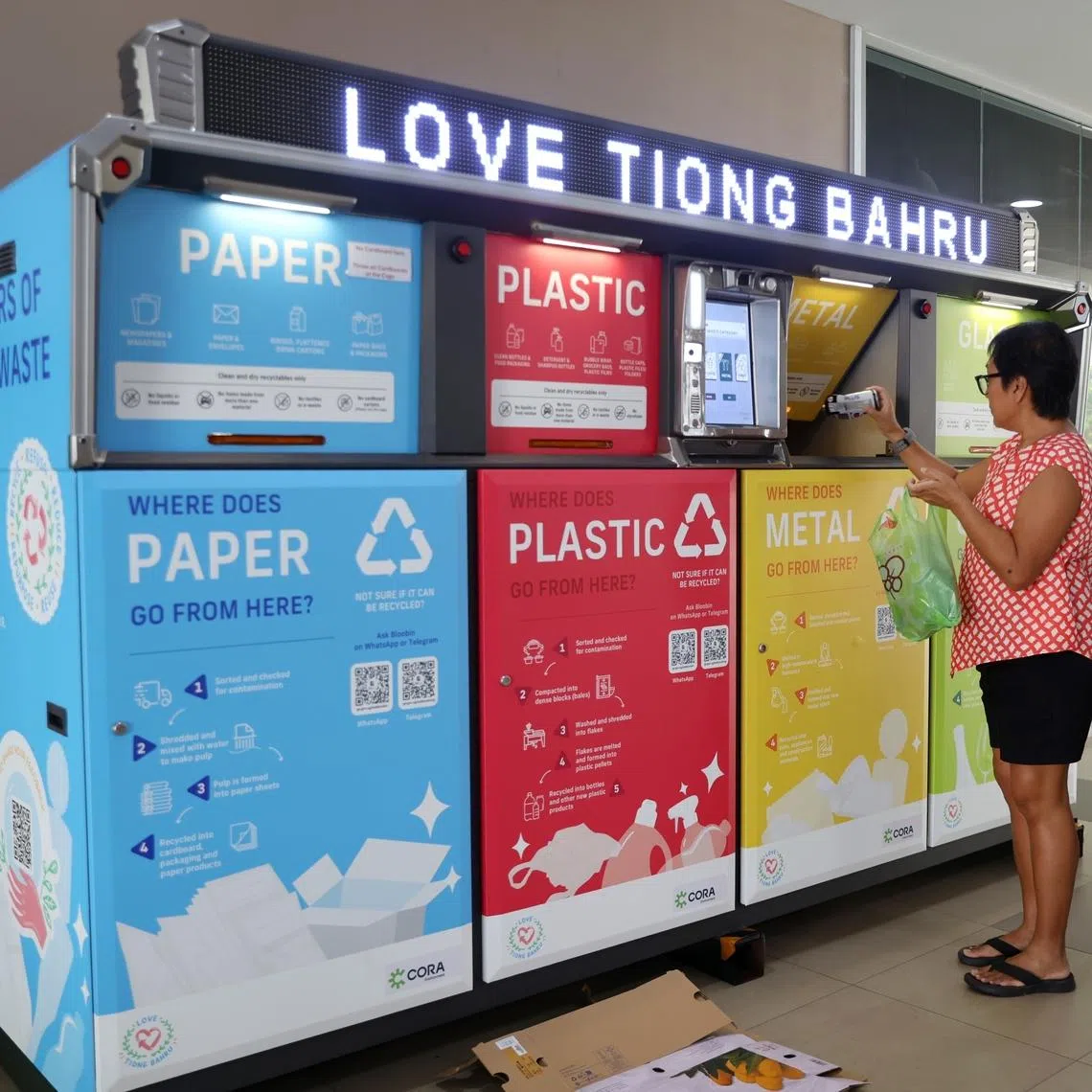 A resident using the new smart recycling machine in Tiong Bahru Community Centre on June 27.