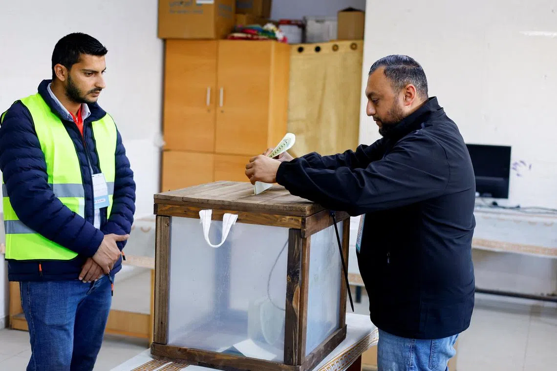 A Palestinian man votes during the municipal election at a polling station in Deir al-Balah, central Gaza Strip April 25, 2026. REUTERS/Mahmoud Issa