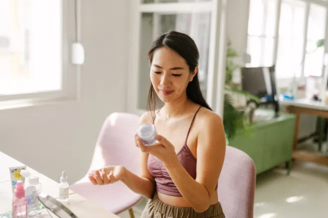 Woman looking at skincare products
