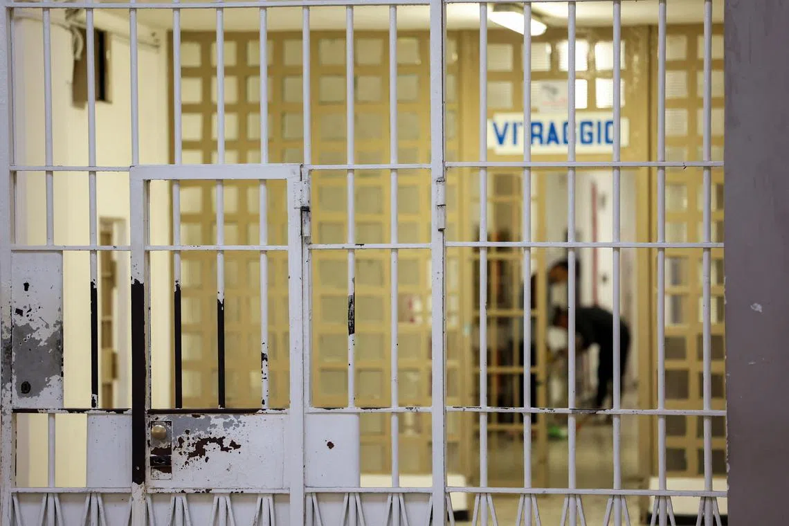 FILE PHOTO: A barred door of a corridor stands inside San Vittore prison in Milan, Italy, March 4, 2024. REUTERS/Claudia Greco/File Photo