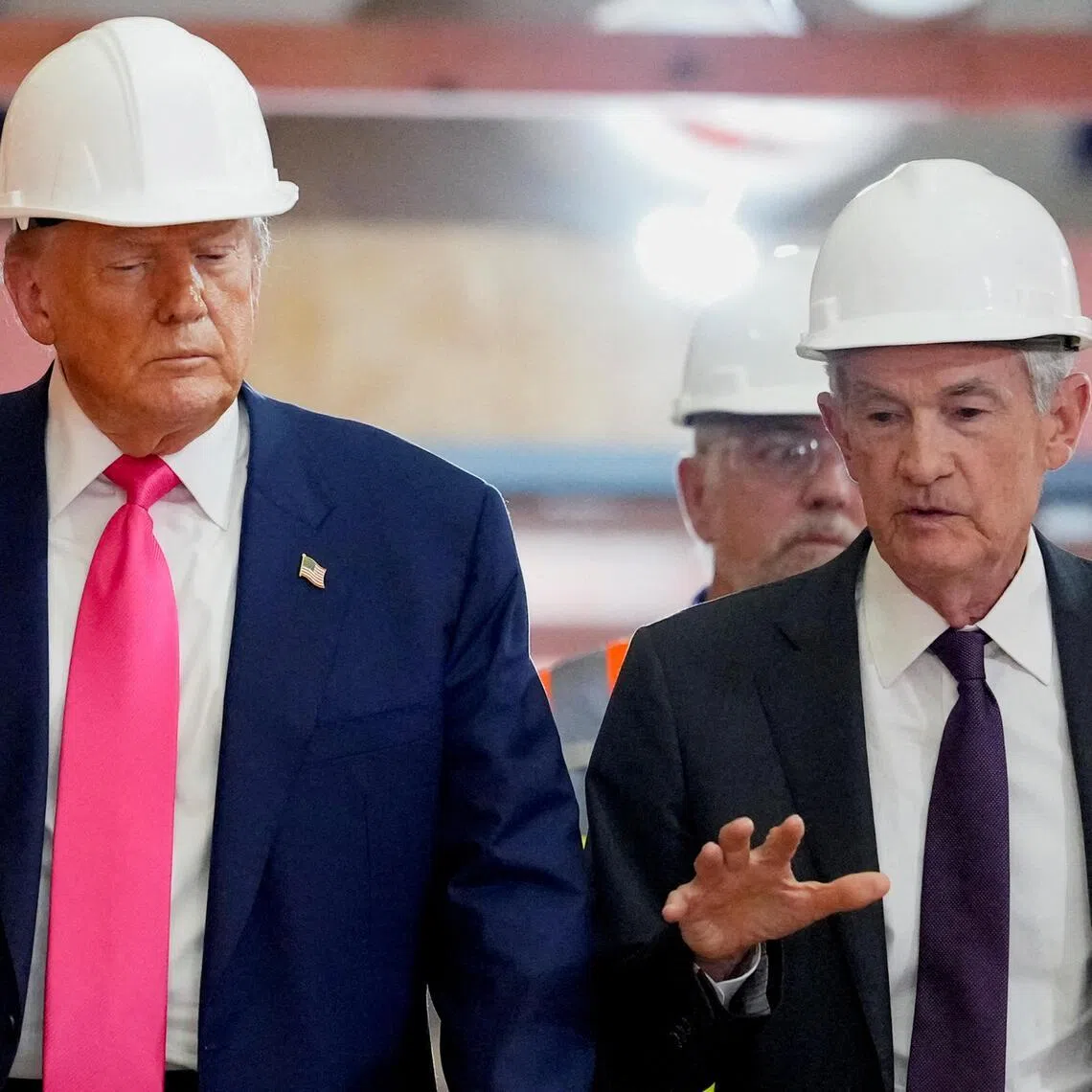 US President Donald Trump listens to Federal Reserve Chair Jerome Powell in July 2025.