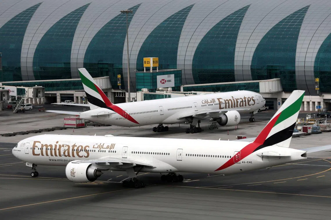 FILE PHOTO: Emirates Airline Boeing 777-300ER planes are seen at Dubai International Airport in the United Arab Emirates February 15, 2019. REUTERS/Christopher Pike/File Photo
