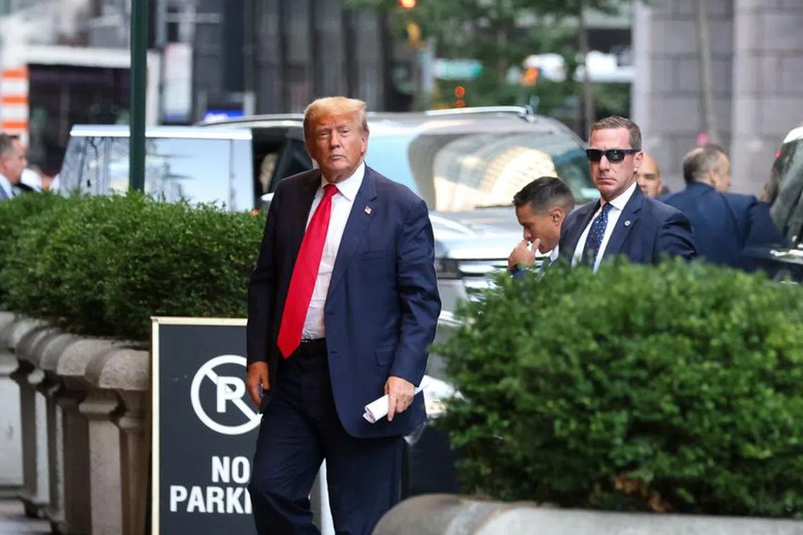 Former U.S. President Donald Trump walks outside as the trial of himself, his adult sons, the Trump Organization and others in a civil fraud case brought by state Attorney General Letitia James continues, in New York City, U.S., October 3, 2023. REUTERS/Caitlin Ochs