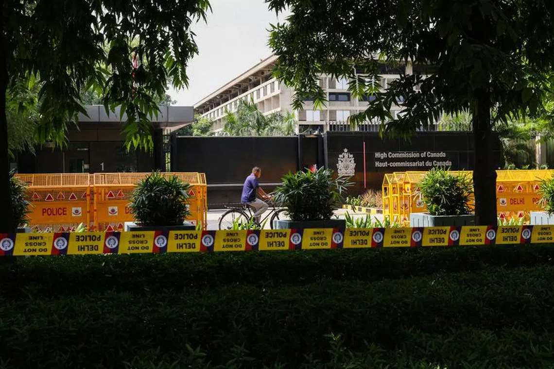 A man on a bicycle passes by the Canadian High-Commision in New Delhi, India, September 20, 2023. REUTERS/Anushree Fadnavis/File Photo