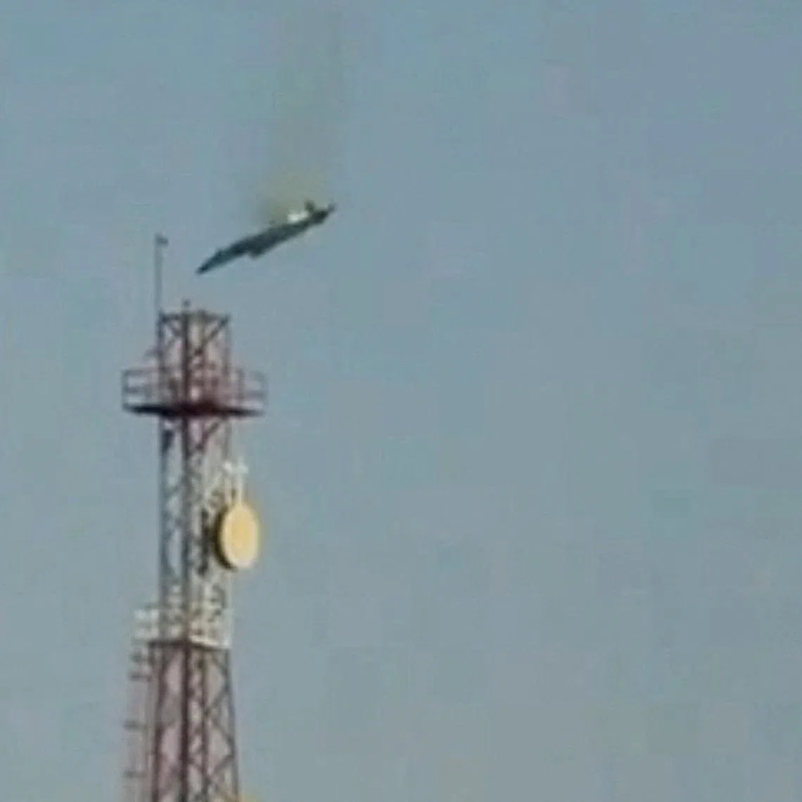 A burning aircraft falls from the sky in Al Jahra, Kuwait, in this still image obtained from social media video released on March 2, 2026. Social Media/via REUTERS