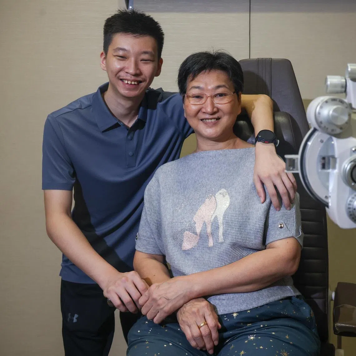 Madam Tan Lee Chern's blurry vision in her left eye turned out to be a rare condition where her immune system condition  and her son Mr Lee Rui Xuan pose for a photo at TTSH eye centre on May 15, 2026. ST PHOTO: JASON QUAH