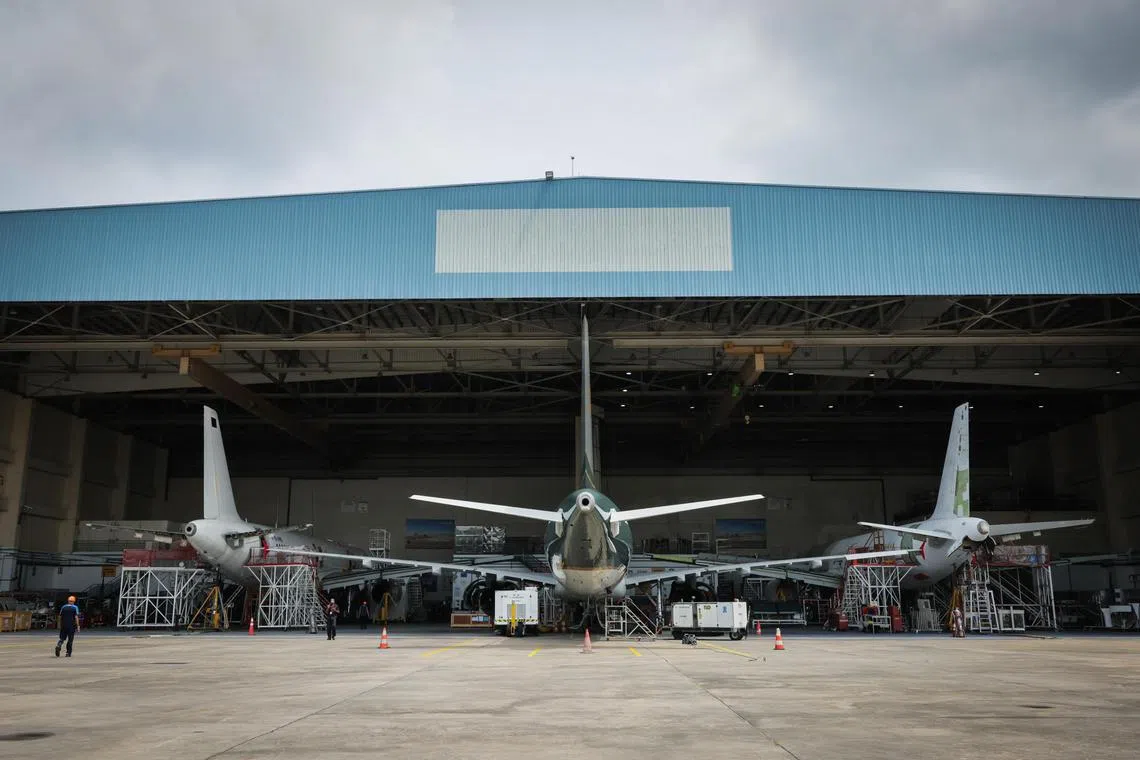 ST20240207_202454992664: Gin Tay/ mystengg07/ Mike Yeo/
Three of the Airbus A321 airliners being converted into freighter aircraft at the company’s Passenger-to-freighter (P2F) conversion facilities at Seletar Aerospace Park. There were five aircraft at various stages of the conversion process when the Straits Times visited on Feb 7, 2024.